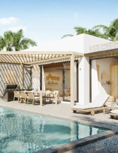 Exterior view of the SKHAI villa Sunrise Garden in Koh Samui, Thailand, with private pool, sun loungers, and outdoor dining area surrounded by tropical greenery